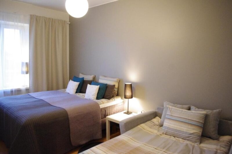 Кровати в апартаментах Borent Suite 4* в городе Турку