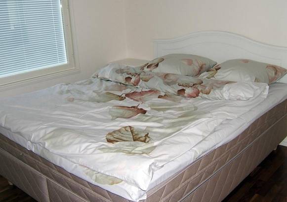 Двухспальная кровать на вилле Kiurukiventie Apartment 3*