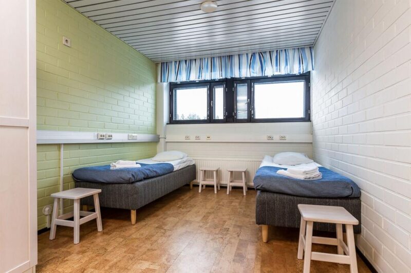 Две односпальные кровати в хостеле Imatra Spa Sport Camp